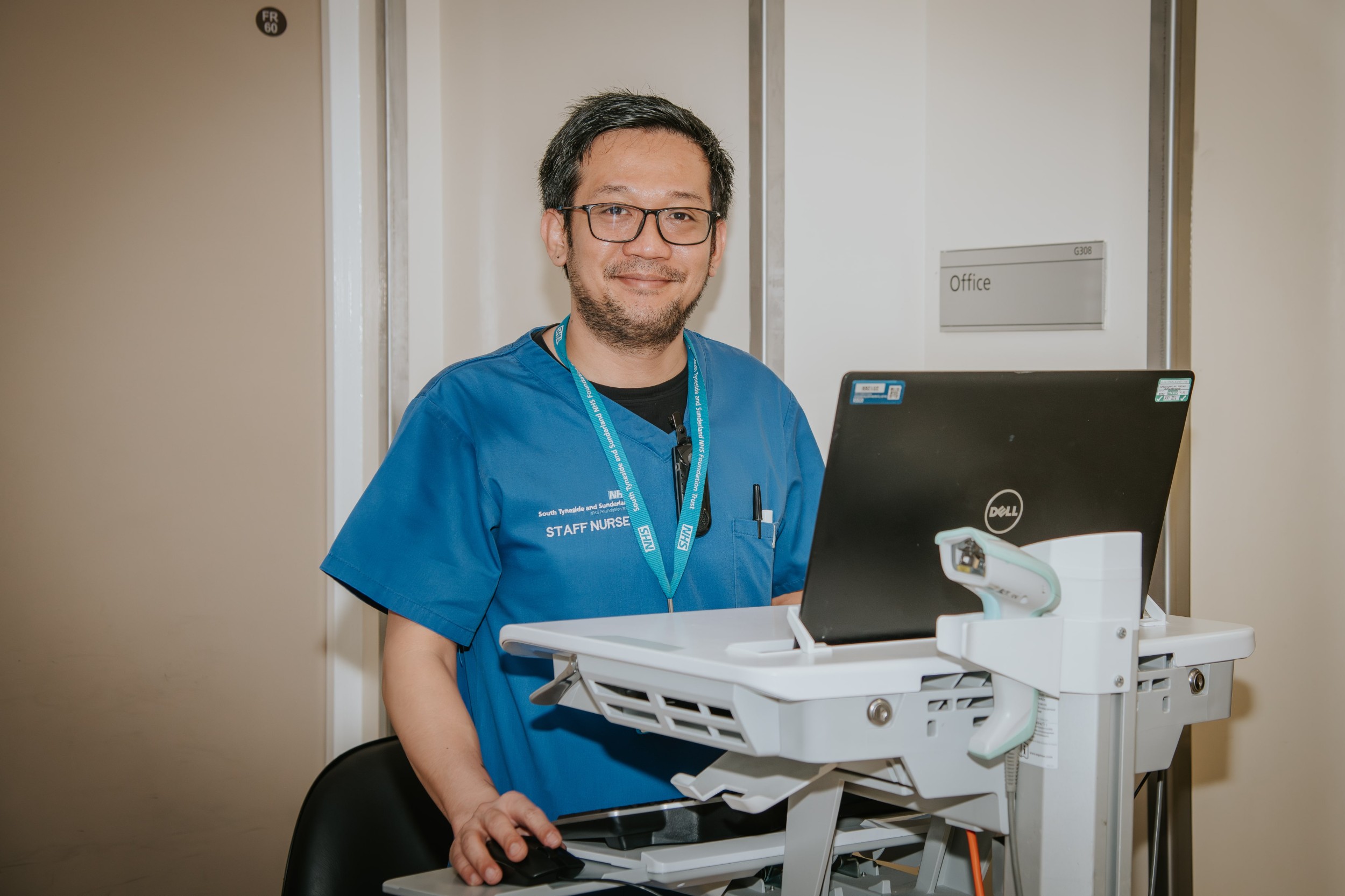 Staff nurse using laptop
