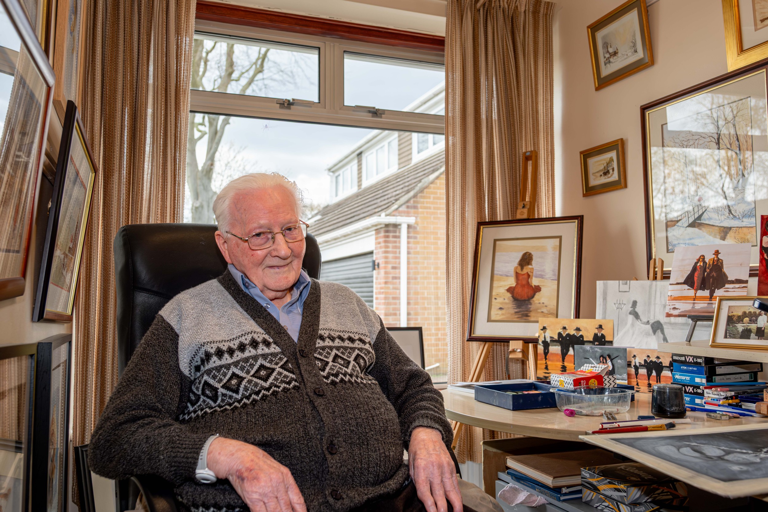 David Hughes MBE smiling in his home art studio.jpg
