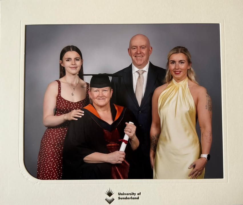 Maggie and her family at graduation.jpg