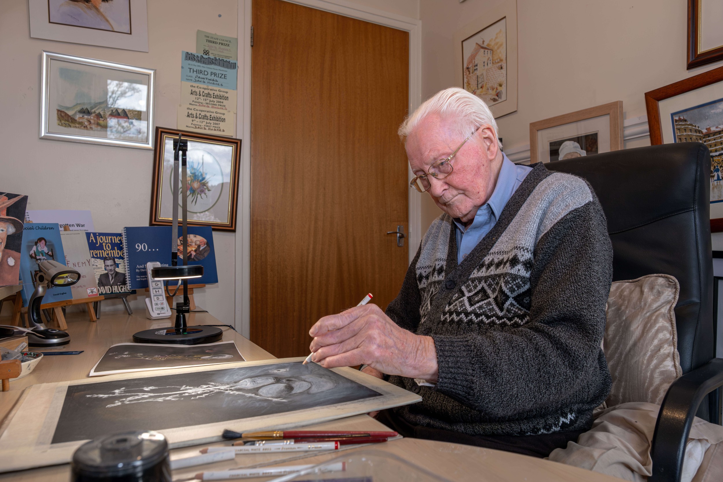 David Hughes MBE in his home studio drawing.jpg